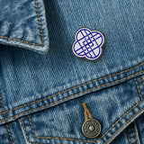 HUNTRIX logo pin attached to denim jacket