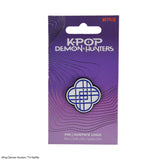 HUNTRIX logo pin on official KPop Demon Hunters packaging