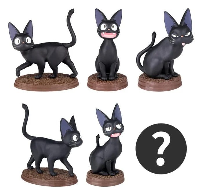 Close-up of Jiji PVC mini figures from Kiki’s Delivery Service blind box series on round bases.