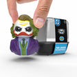 Mini Joker TUBBZ duck being held by fingers in front of packaging