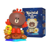 Cancer Brown in red crab costume with Sally, seated on an orange crystal crab with smiling face.