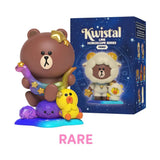Rare Ophiuchus version of Brown holding a pastel snake with star and Sally seated on a glowing crystal.
