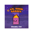Lil Burn Barrel soft enamel pin featuring a pink burning barrel character on illustrated backing card