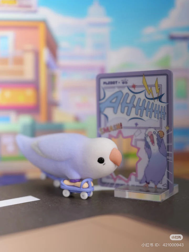 Lovebird vinyl figure riding a skateboard with comic panel accessory