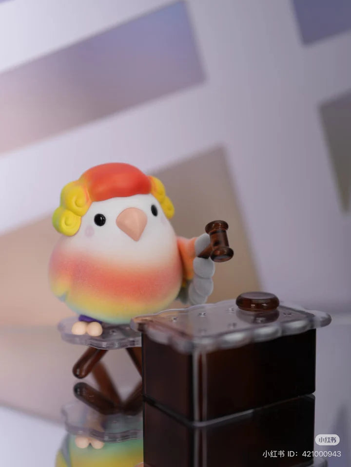 Color variant Judge Lovebird vinyl figure with red and yellow details