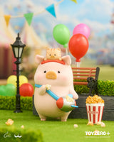 LuLu The Piggy enjoying popcorn at the amusement park while carrying a popcorn machine bag