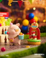 LuLu The Piggy carrying colorful carnival snacks beside a LuLuland food stand attraction