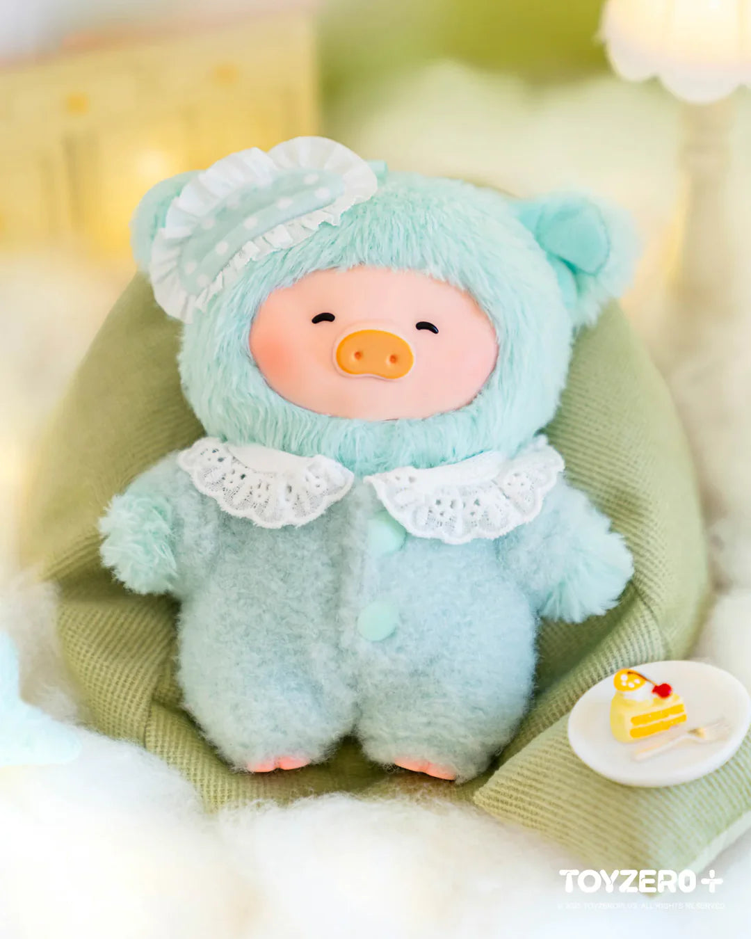 Mint green LuLu The Piggy Dreaming Wonderland plush keychain with smiling expression and bedtime outfit