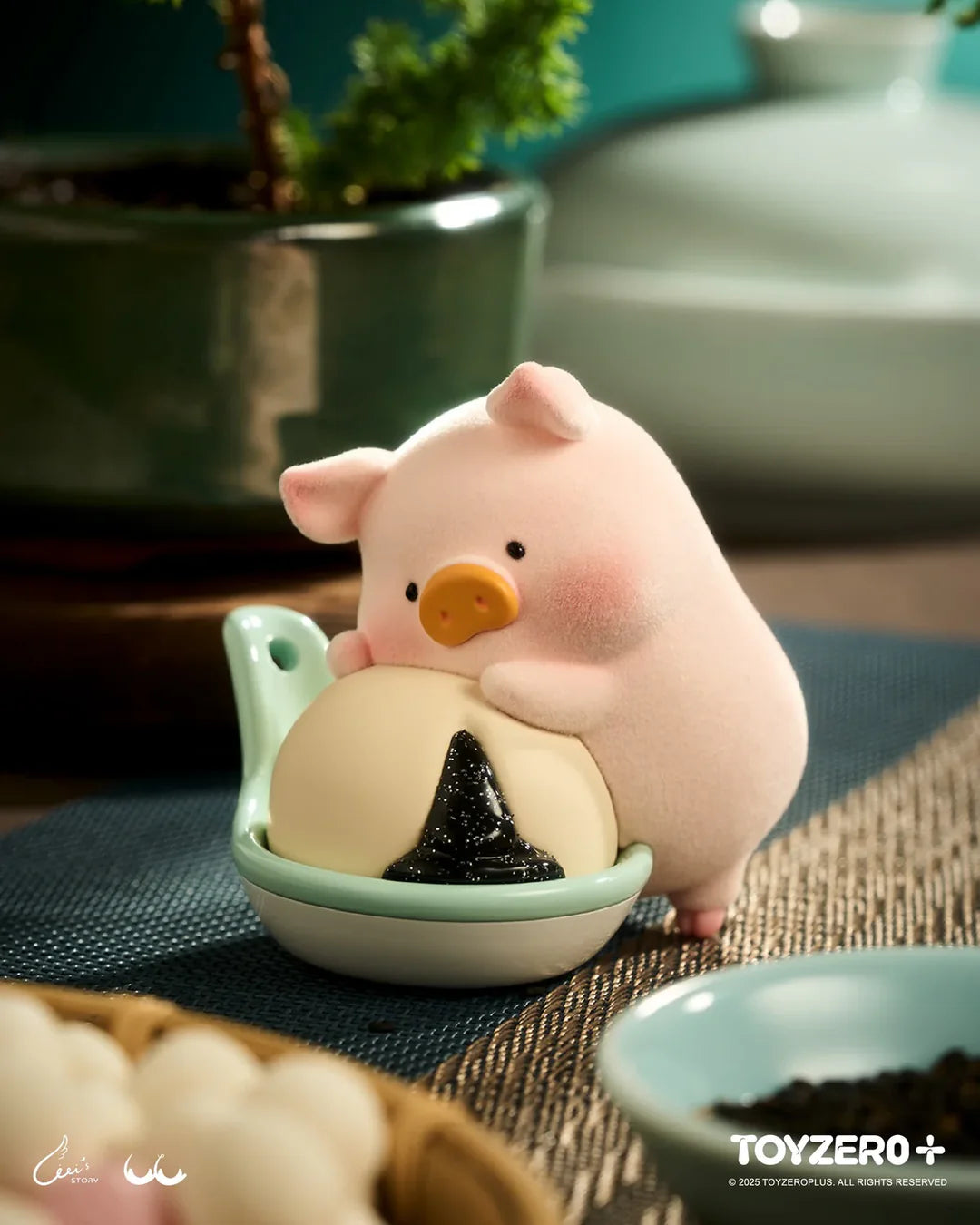 LuLu the Piggy hugging a rice ball figure from Lu's Table Blind Box.