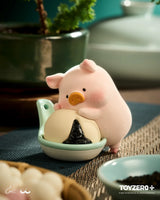 LuLu the Piggy hugging a rice ball figure from Lu's Table Blind Box.
