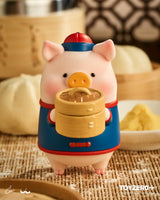 LuLu the Piggy dim sum chef holding bamboo steamer lifestyle image.