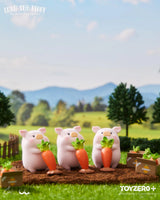 LuLu The Piggy harvesting giant carrots in a vegetable garden collectible figure