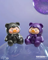 Black and purple metallic LuLu The Piggy teddy bear mini figures displayed on translucent purple spheres