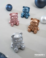 Metallic silver, rose gold, bronze, and blue LuLu The Piggy teddy bear mini collectible figures