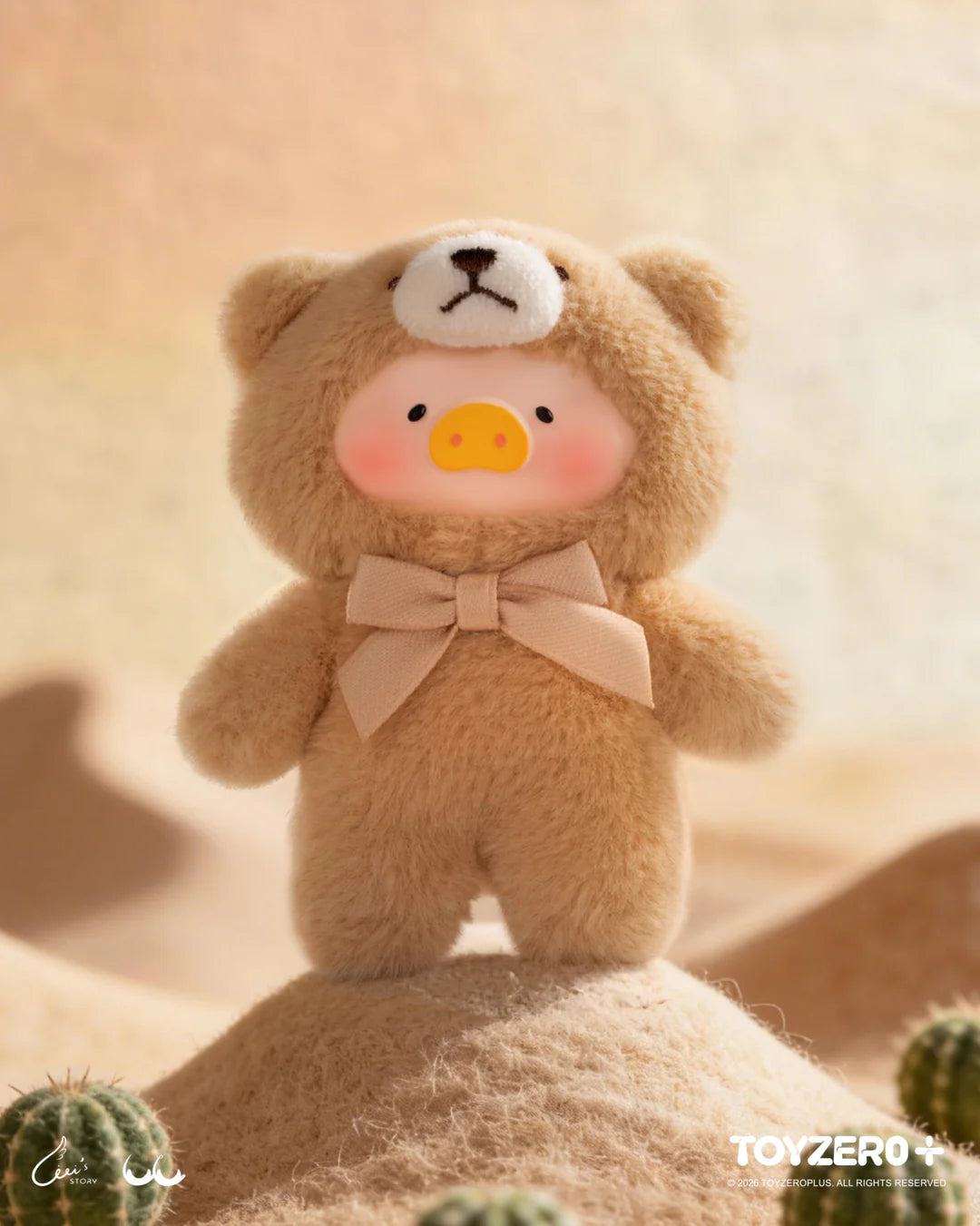 LuLu The Piggy in a beige teddy bear outfit standing among desert-inspired scenery