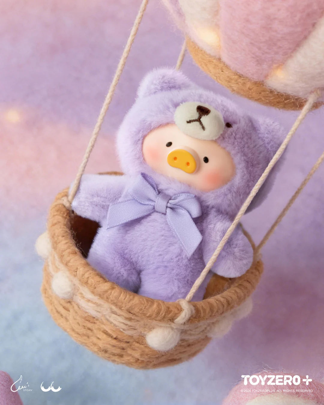 LuLu The Piggy in a lavender teddy bear costume riding inside a hot air balloon basket
