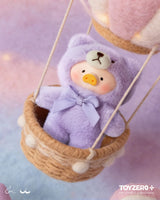 LuLu The Piggy in a lavender teddy bear costume riding inside a hot air balloon basket