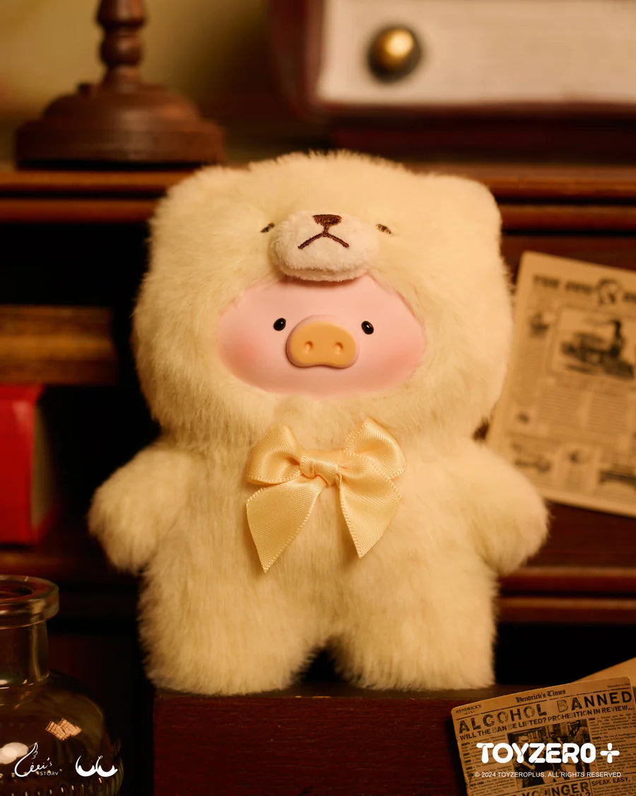 LuLu the Piggy Vintage Teddy Shop plush in light blue teddy bear outfit with blue ribbon.