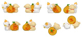 Orange Wishes Maltese Lucky Paws collectible featuring a lucky orange ornament shown from multiple angles.