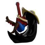 Side view of Marceline Youtooz figure strumming her guitar while floating with her hair flowing.