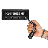 Megadeth guitar plug keychain plugged into Jack Rack holder