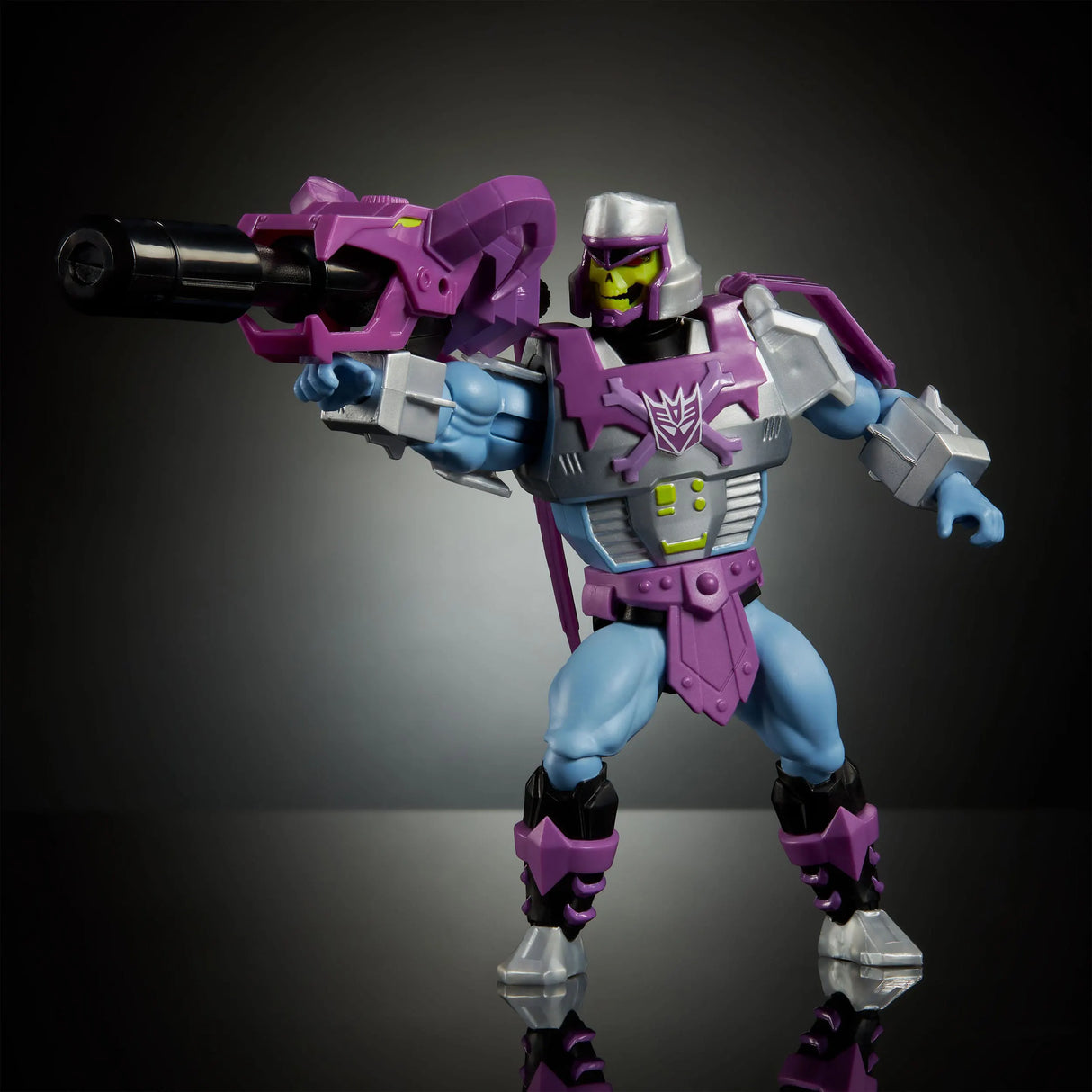 Dual-weapon action pose featuring Megatron Armor Skeletor with cannon and translucent mace.