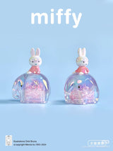 Two Miffy Elephant Series figures with pink-themed translucent elephants and sparkling crystal interiors