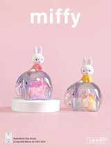 Miffy collectible figures sitting atop pink and yellow translucent elephant companions from the Elephant Series