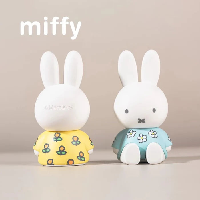 Front and rear view of floral-themed Miffy phone stand figures