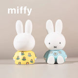 Front and rear view of floral-themed Miffy phone stand figures