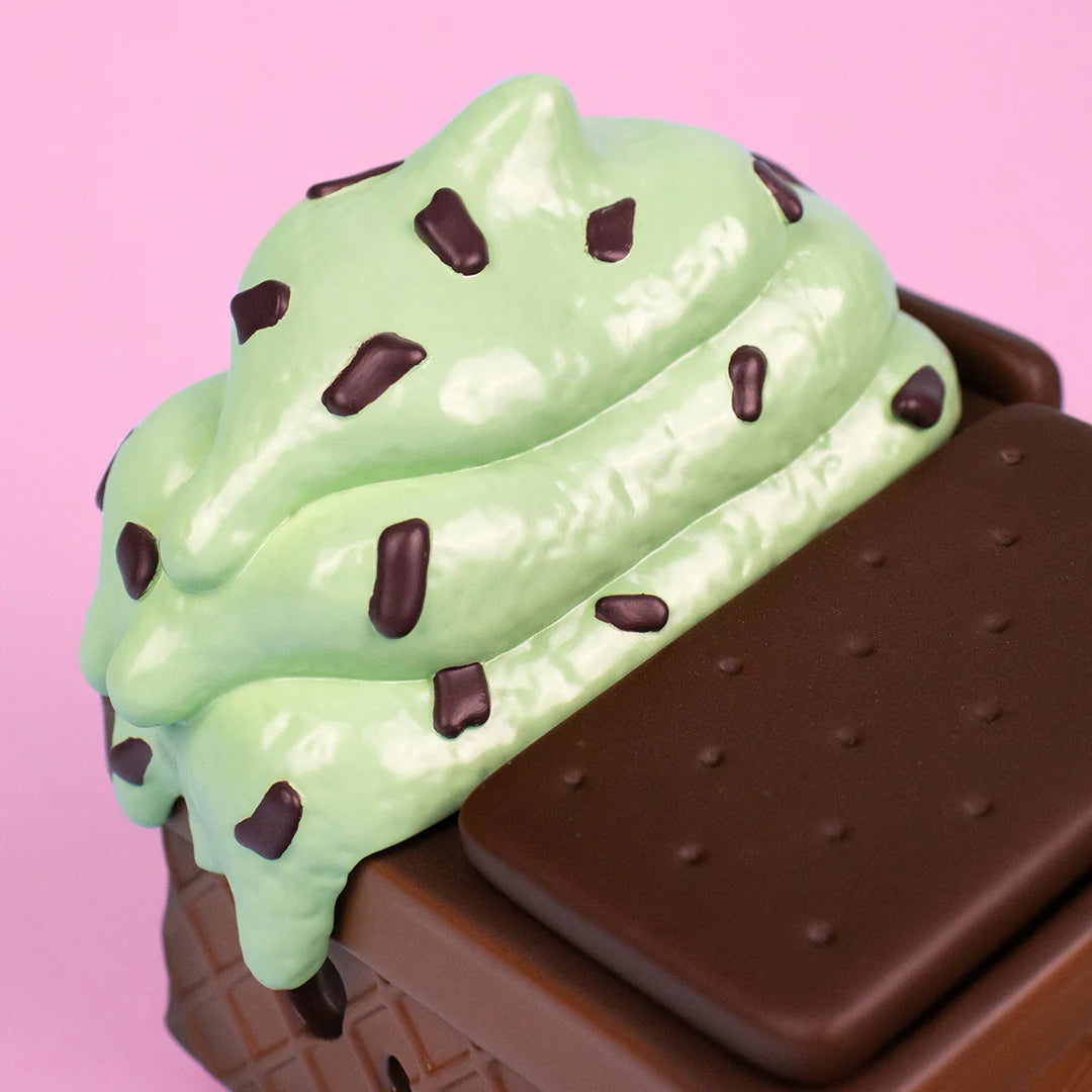 Close-up of mint chip ice cream scoops with chocolate chips on Dumpster Fire figure.