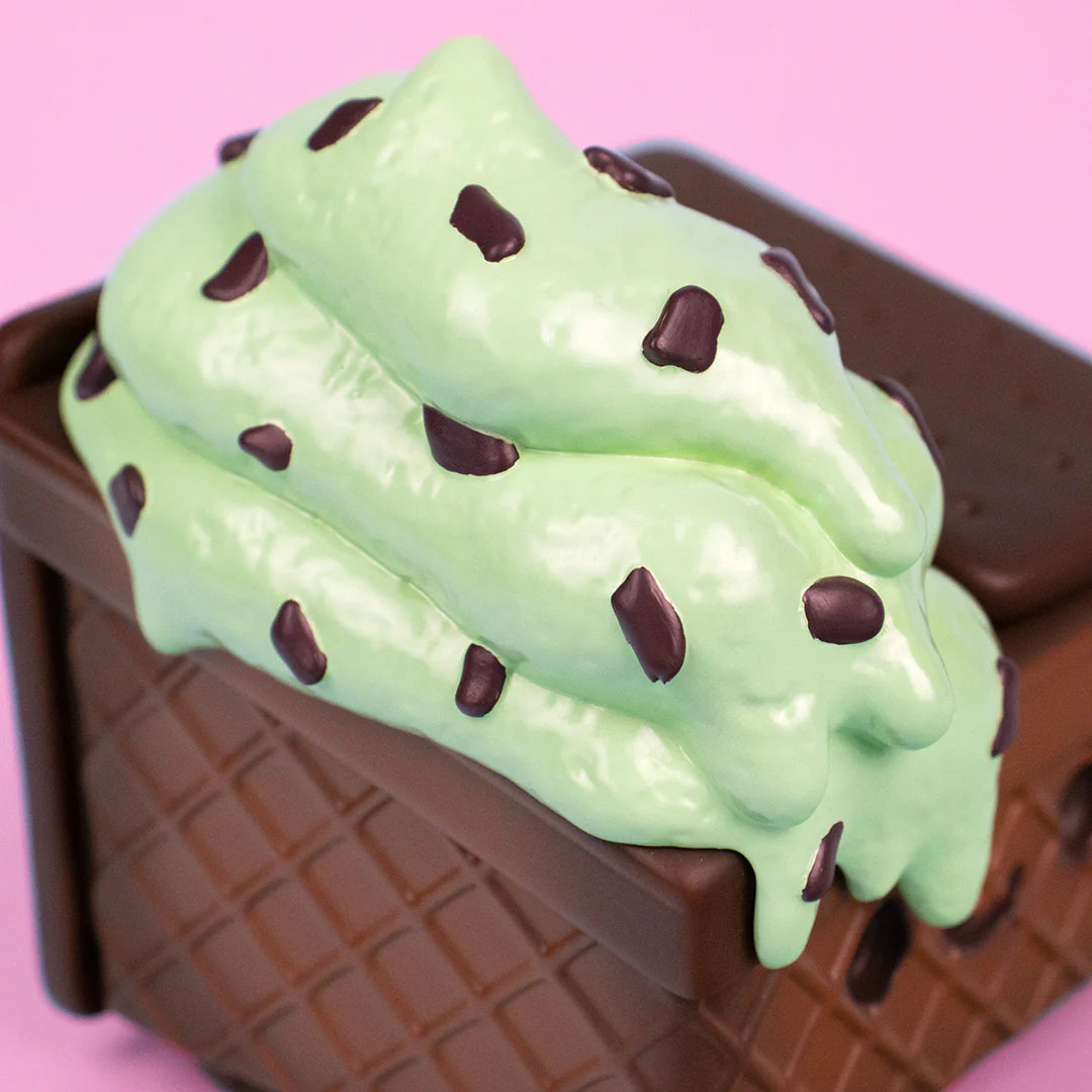 Close-up of mint chip ice cream scoops with chocolate chips on Dumpster Fire figure.