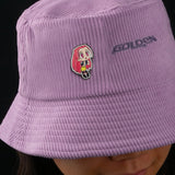 Mira pin attached to pink bucket hat outfit styling