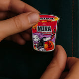 Mira noodles pin KPop Demon Hunters held in hand close up