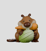 misbeavhaving beaver holding cabbage and carrot figure