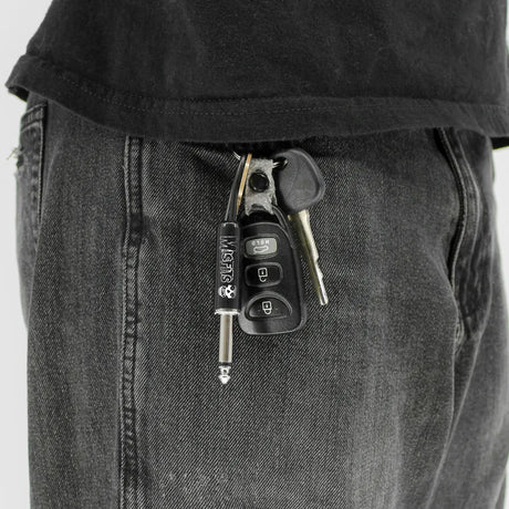 Misfits plug keychain attached to keys in pocket