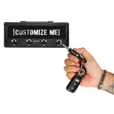 Misfits guitar plug keychain being plugged into Jack Rack holder