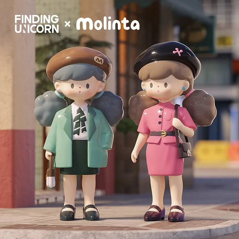 Two Molinta Retro Girl vinyl figures—one in a green jacket with skirt, the other in a pink retro dress with black beret.