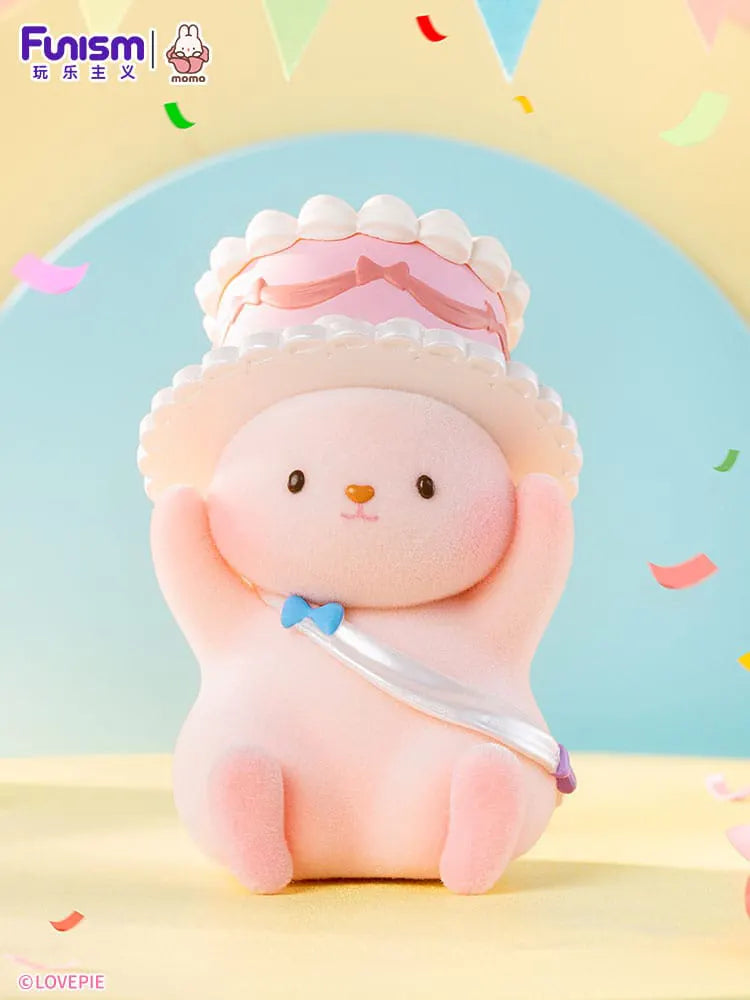 Momo Bunny Strawberry Town figure with party hat and cake.