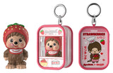 Monchhichi Keychain Pouch Blind Box featuring a strawberry-themed Monchhichi figure with matching pink zippered keychain pouch.