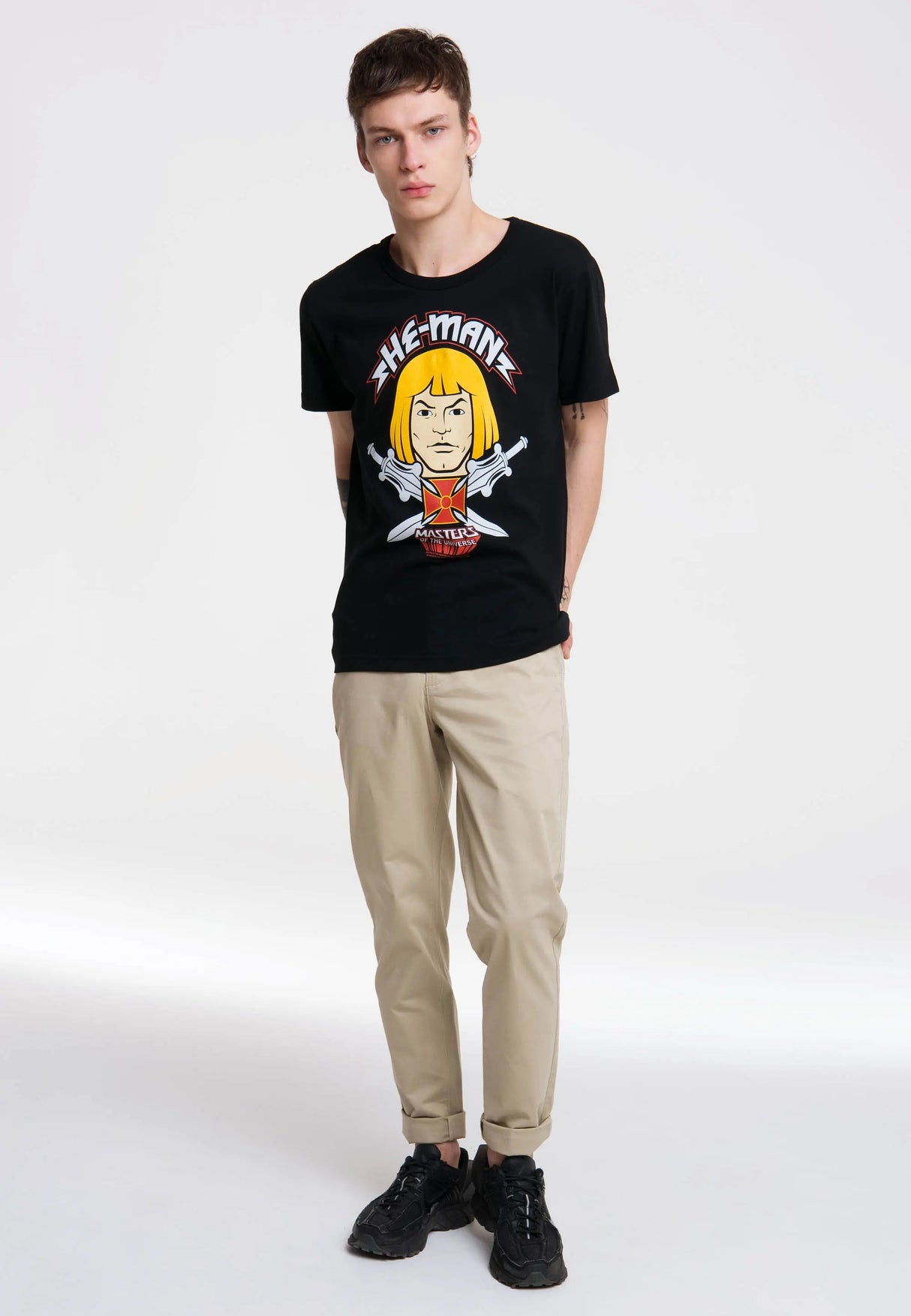 Full-body view of model wearing the black He-Man Face T-Shirt from Masters of the Universe