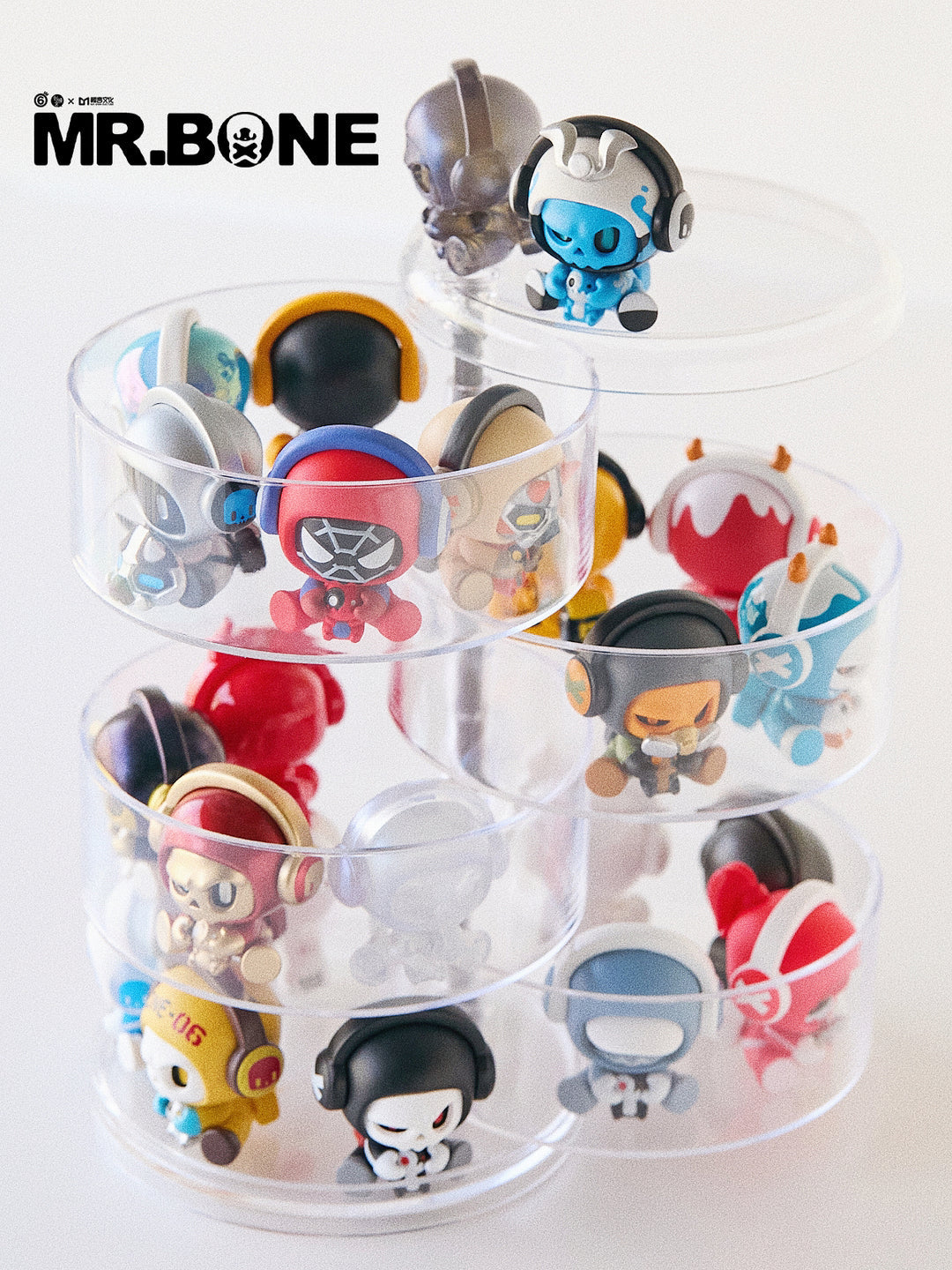 Mr. Bone Baby Bone figures arranged on a clear multi-tier display stand.