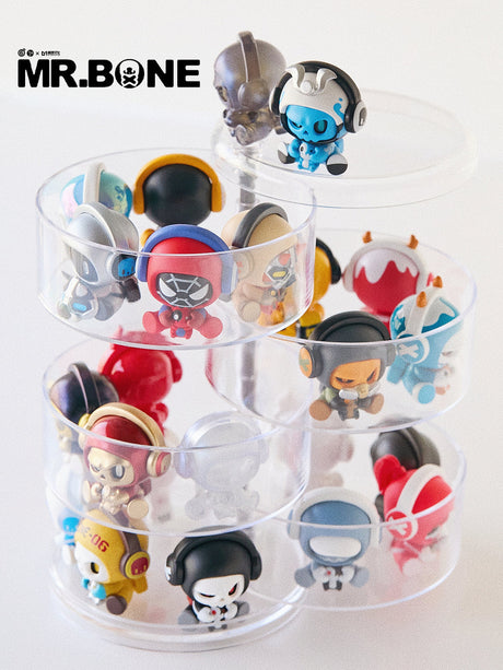 Mr. Bone Baby Bone figures arranged on a clear multi-tier display stand.
