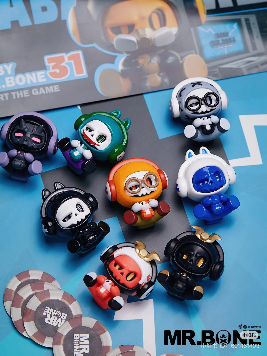 Assorted Baby Bone figures on a blue background with Mr. Bone logo and poker-style chips.