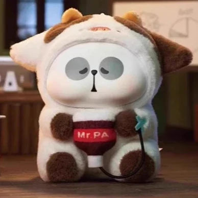 Mr.PA cow costume plush holding a microphone.