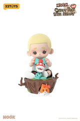 Sitting Nook holding creature with cat companion under tree stump display