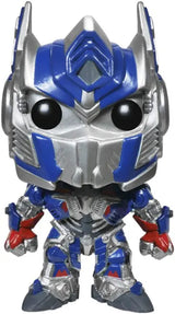 Close-up of Funko Pop! Optimus Prime figure with red, blue, and silver robot detailing.