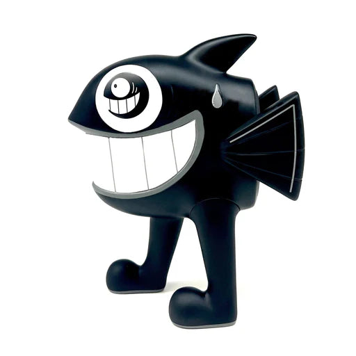 Side view of Pez's The Walking Fish art toy in black colorway