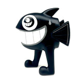 Side view of Pez's The Walking Fish art toy in black colorway