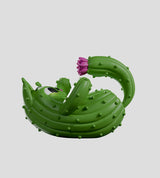 Pricklepuss cactus cat figure in playful pose with raised tail and flower